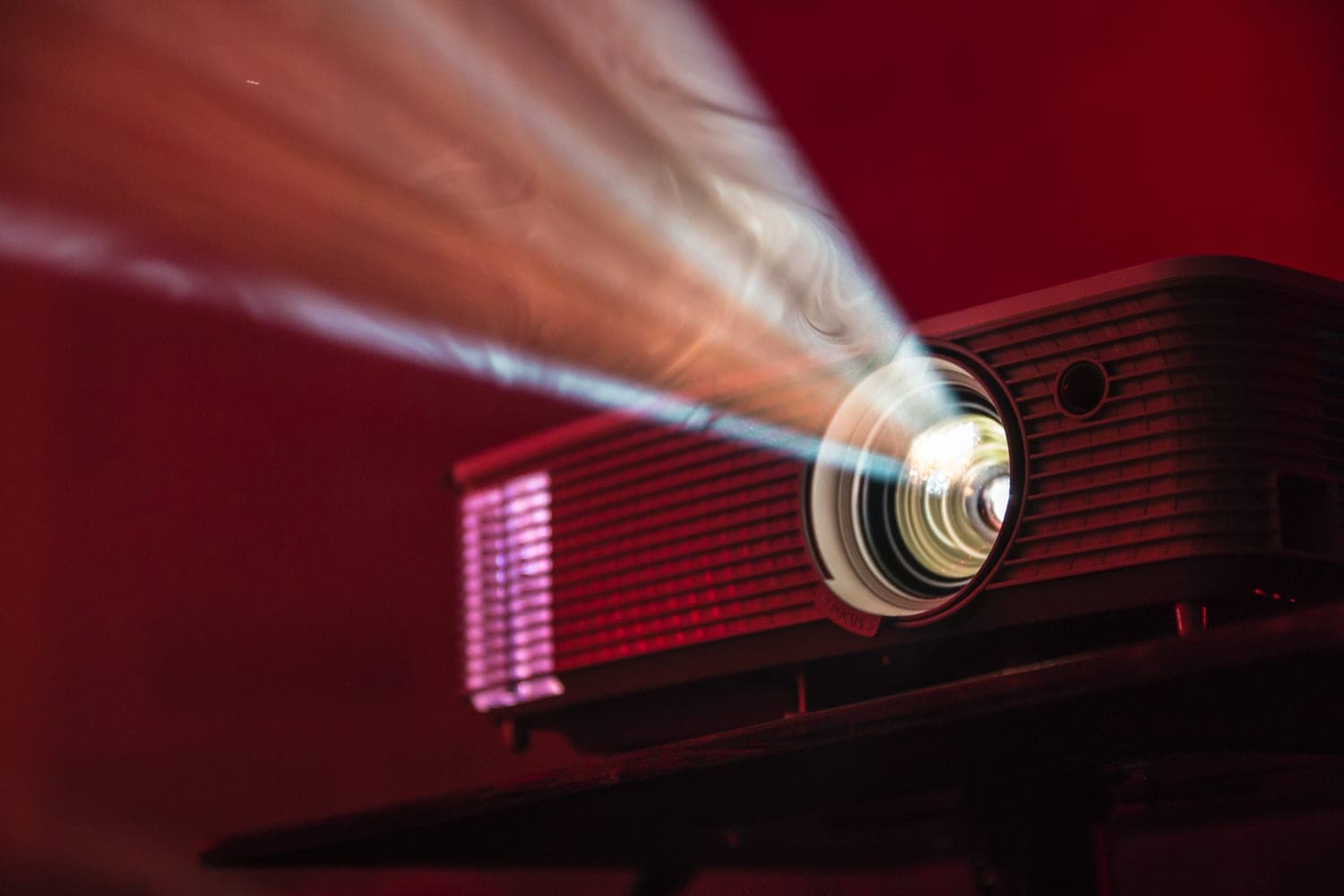 A projector beams light in a dark room.